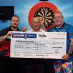 Dimitri Van den Bergh, Fred Done and Peter Wight holding a ￡33,000 charity check.