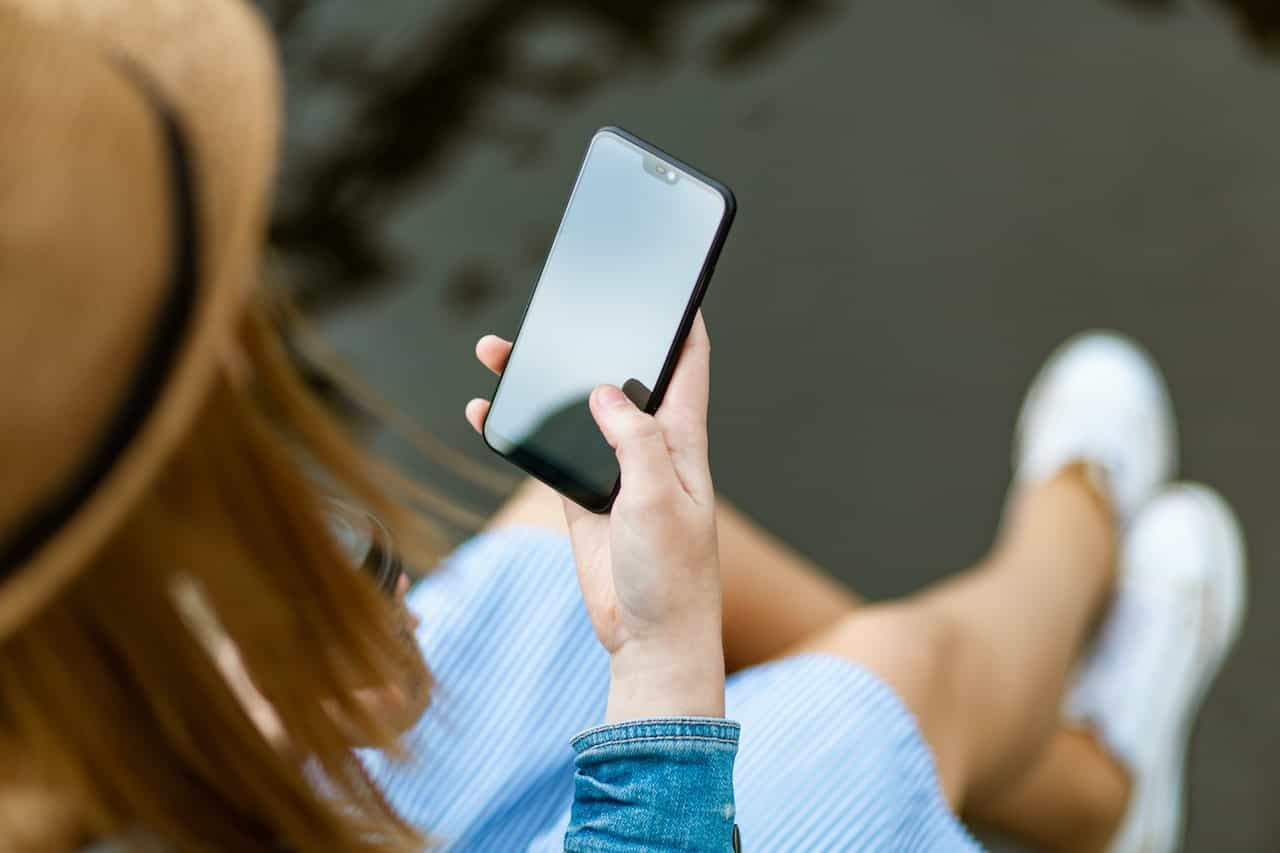 A woman using a smartphone.