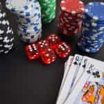 Poker chips, dice and playing cards.