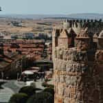 An old, picturesque stone building high over Avila, Spain.