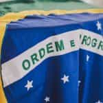 The Brazilian flag is draped over a table.